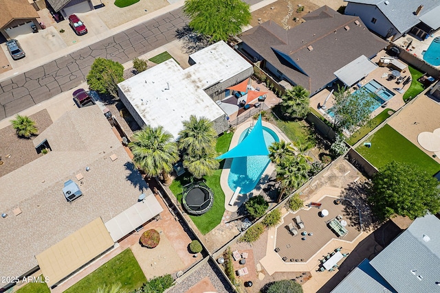 aerial view of residential area with a pool