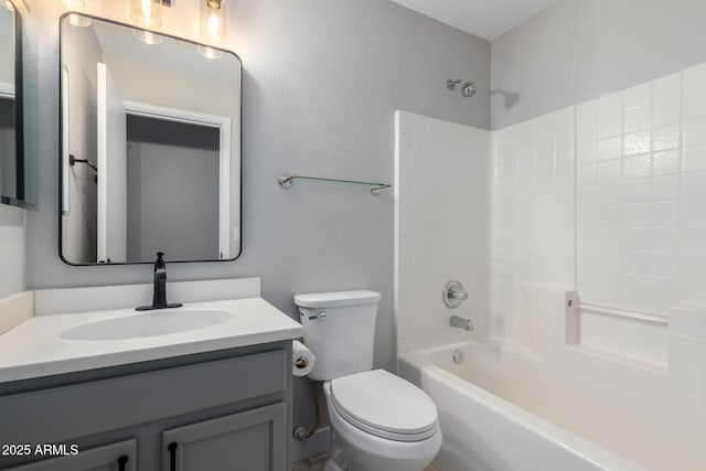 bathroom with toilet, vanity, and tub / shower combination