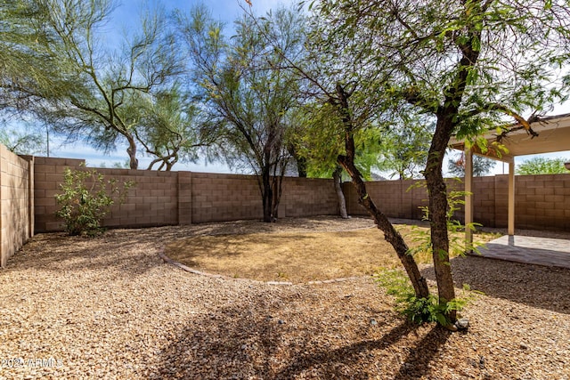 fenced backyard featuring a patio