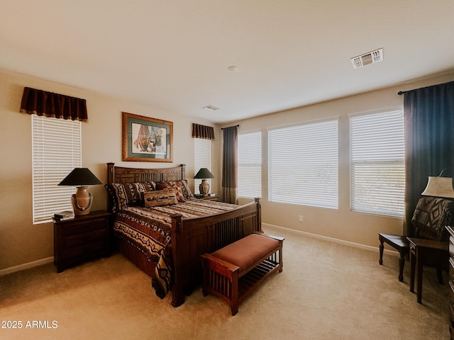 bedroom with light colored carpet