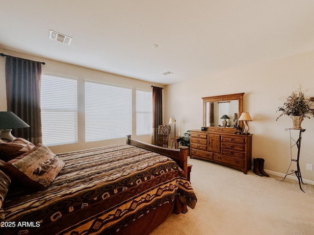 bedroom featuring light carpet