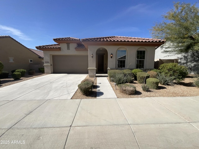 mediterranean / spanish-style house featuring a garage