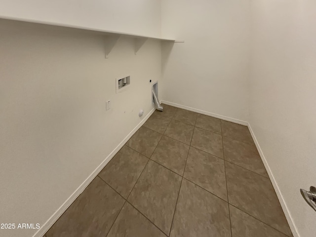 washroom with dark tile patterned floors, electric dryer hookup, and washer hookup