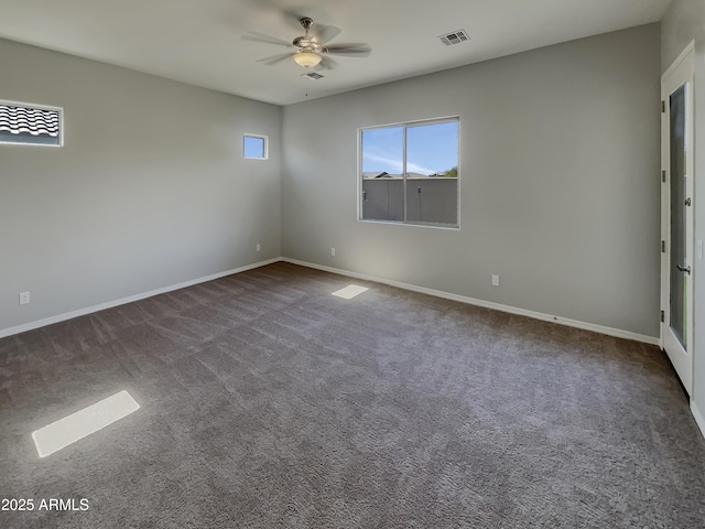carpeted spare room with ceiling fan