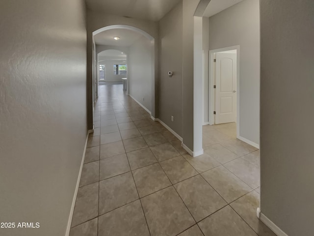 corridor with light tile patterned flooring