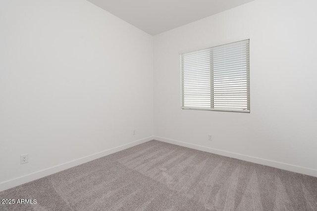 366 E Las Perlas Ln, San Tan Valley, AZ 85140 - spare room featuring carpet flooring, baseboards, and vaulted ceiling