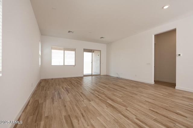 366 E Las Perlas Ln, San Tan Valley, AZ 85140 - unfurnished room with light wood-style flooring, baseboards, and recessed lighting