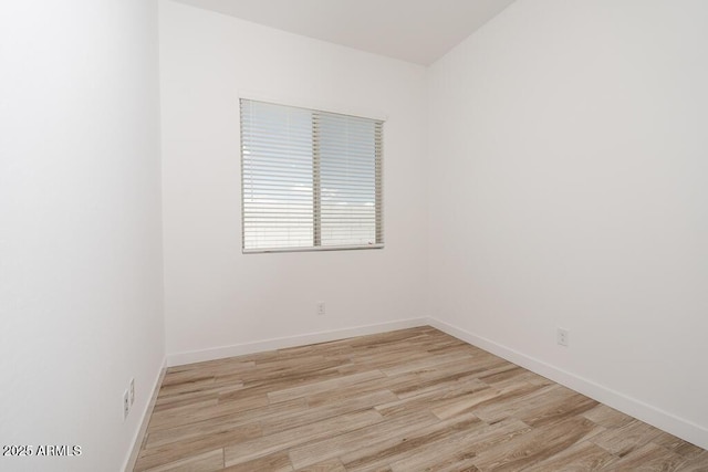 366 E Las Perlas Ln, San Tan Valley, AZ 85140 - spare room featuring light wood-style floors and baseboards