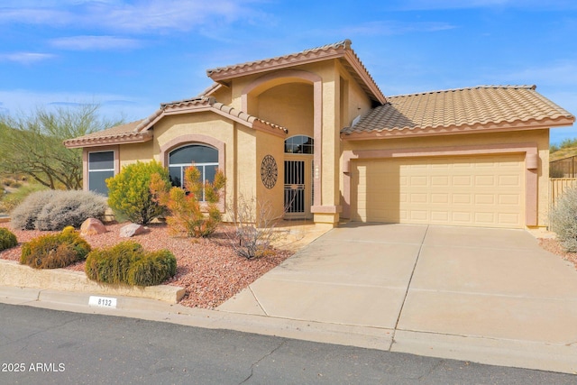 mediterranean / spanish-style house featuring a garage