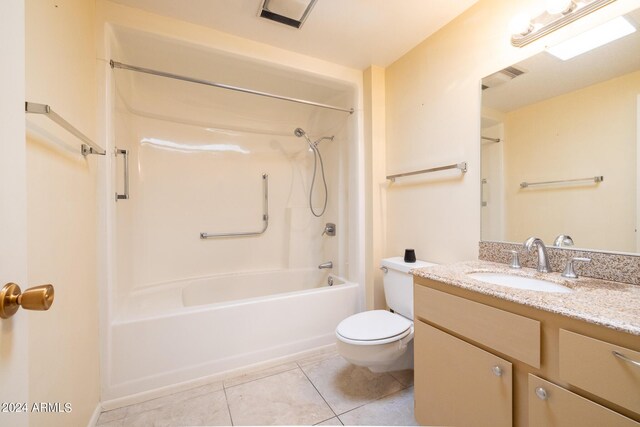 full bathroom featuring vanity, tile patterned flooring, toilet, and washtub / shower combination