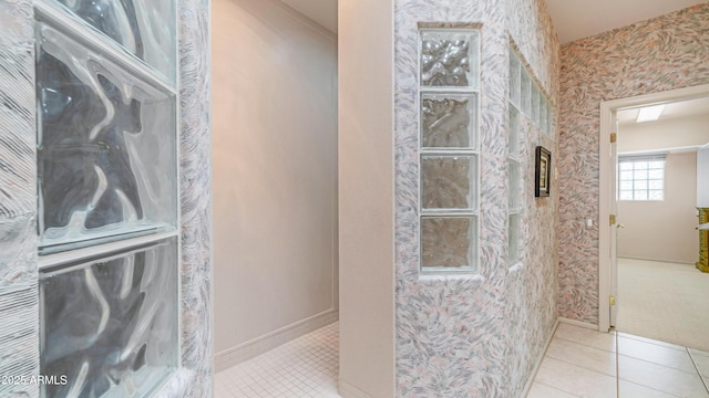 bathroom with tile patterned floors and wallpapered walls