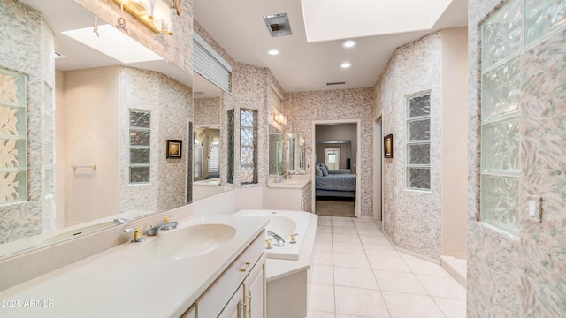 ensuite bathroom featuring wallpapered walls, ensuite bath, tile patterned floors, and a garden tub