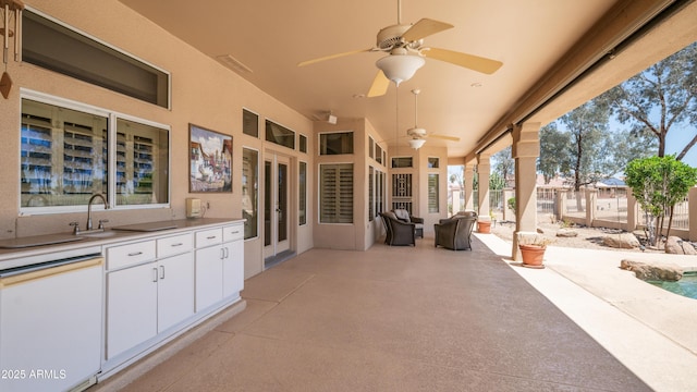 view of patio / terrace featuring a ceiling fan and a sink