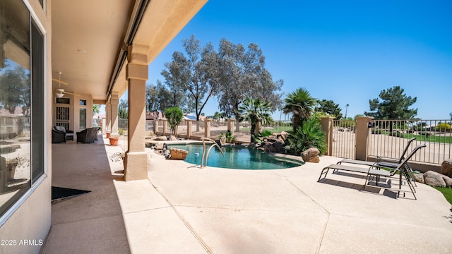 view of pool with a patio area, a fenced in pool, and fence