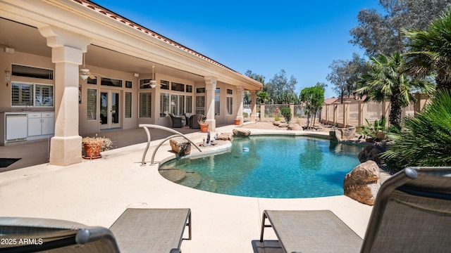 view of swimming pool featuring a patio area, french doors, fence private yard, a fenced in pool, and ceiling fan