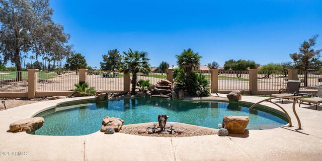 view of pool with a fenced in pool, a patio area, and fence