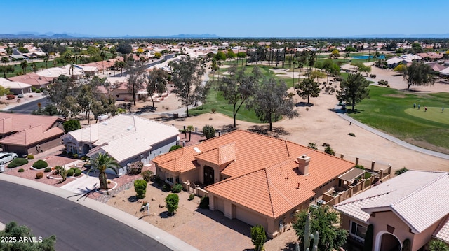aerial view with a water and mountain view, golf course view, and a residential view