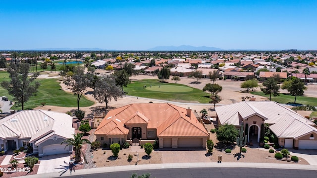 aerial view featuring a residential view, golf course view, and a mountain view