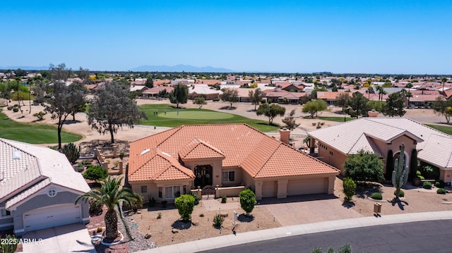 birds eye view of property featuring a mountain view, golf course view, and a residential view