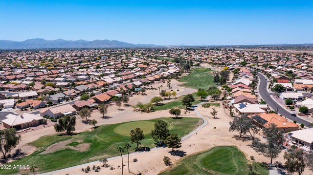 bird's eye view with view of golf course, a residential view, and a mountain view