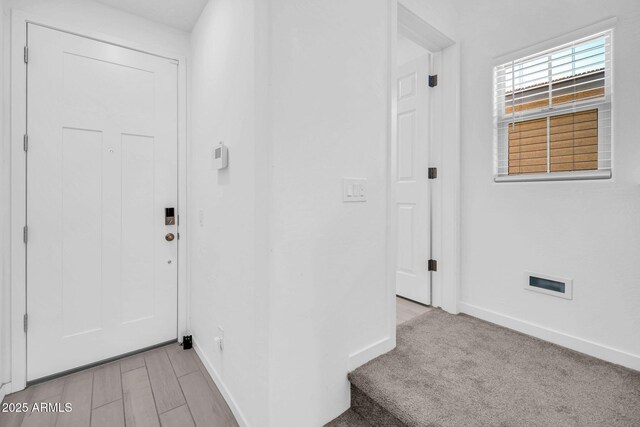 interior space featuring baseboards