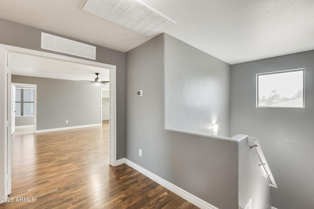 hallway with dark hardwood / wood-style floors