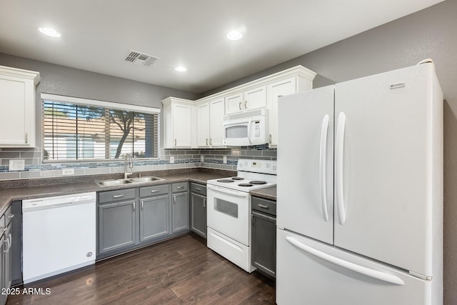 kitchen with sink, white appliances, gray cabinets, white cabinetry, and decorative backsplash