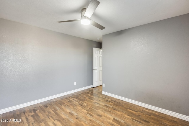 empty room with wood-type flooring and ceiling fan