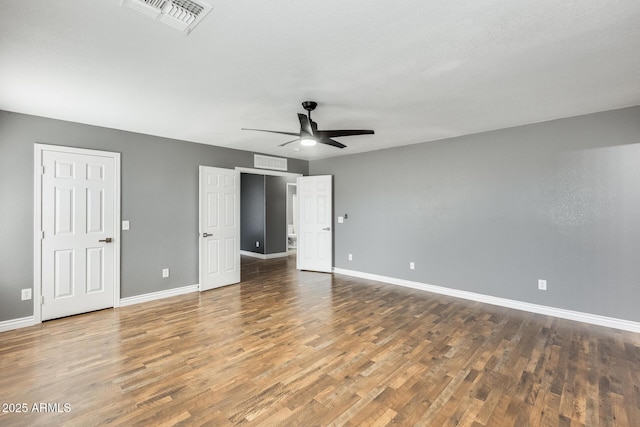 unfurnished bedroom featuring hardwood / wood-style floors and ceiling fan