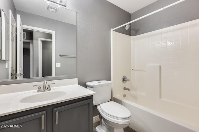 full bathroom featuring shower / tub combination, vanity, and toilet