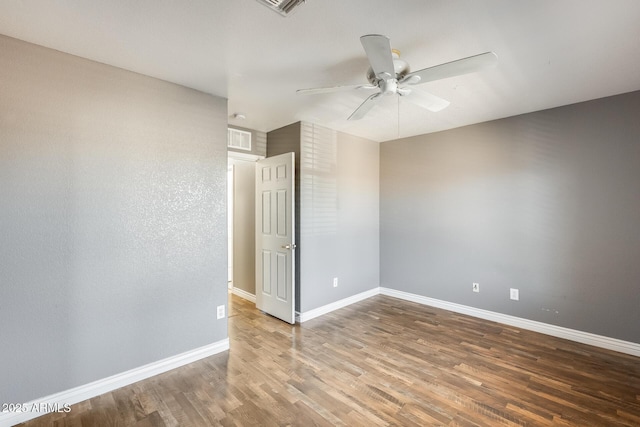 unfurnished room featuring hardwood / wood-style flooring and ceiling fan