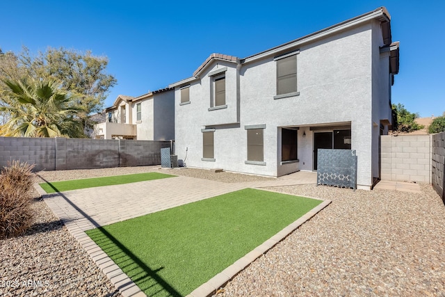 back of house featuring a patio area