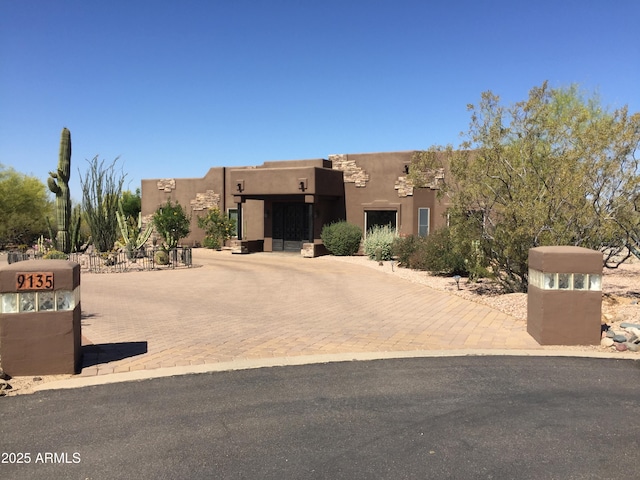 view of pueblo revival-style home