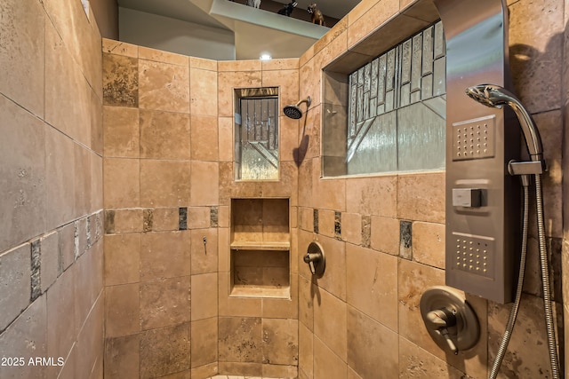 bathroom with tiled shower