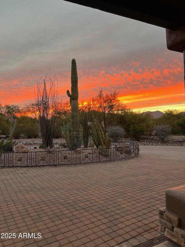 view of patio terrace at dusk