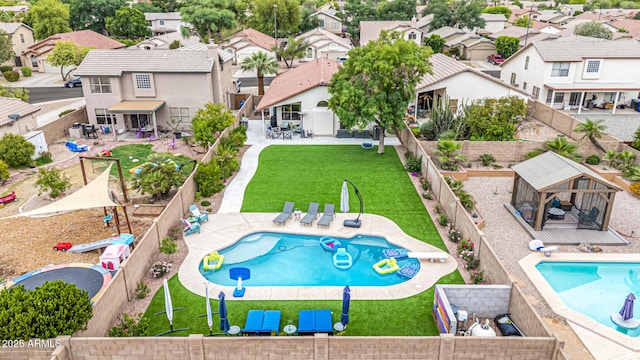 aerial view of residential area featuring a pool