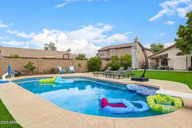 view of swimming pool featuring a patio area