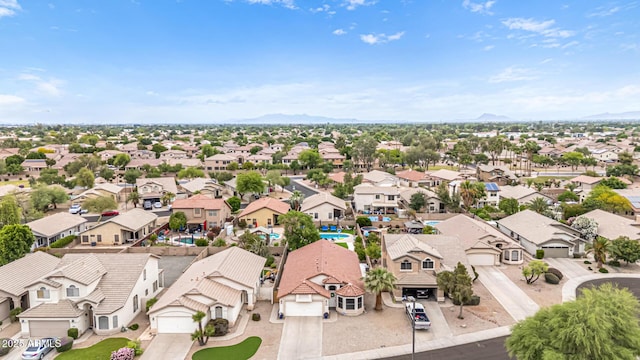 aerial view of residential area featuring a mountainous background
