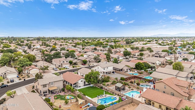 aerial view of residential area featuring a pool