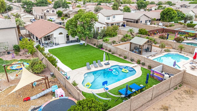 aerial view of residential area featuring a pool area