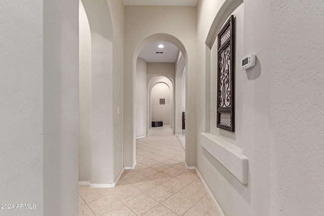 hall with light tile patterned flooring