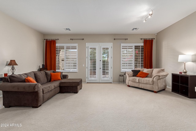 living room featuring carpet and french doors