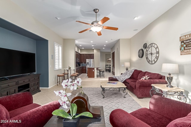 living room with light tile patterned floors and ceiling fan