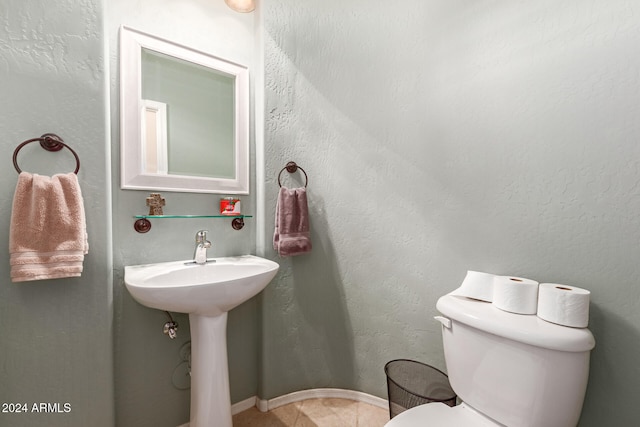 bathroom with tile patterned floors and toilet