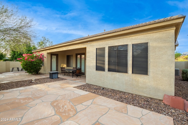 back of house featuring a patio area and central AC