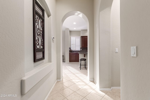 corridor with light tile patterned floors