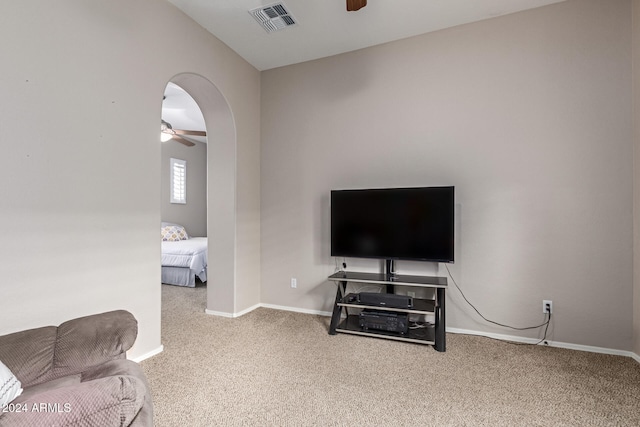 living room with carpet floors and ceiling fan