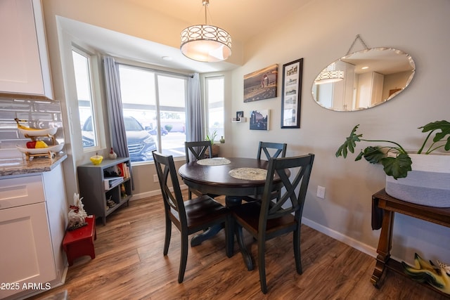 dining area featuring dark hardwood / wood-style flooring