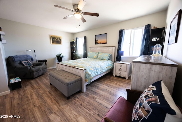bedroom featuring dark hardwood / wood-style floors and ceiling fan