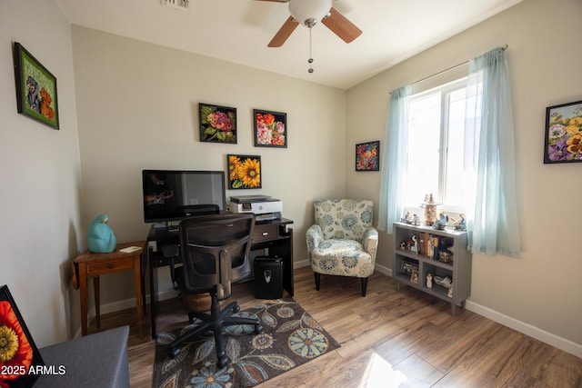 office with hardwood / wood-style flooring and ceiling fan